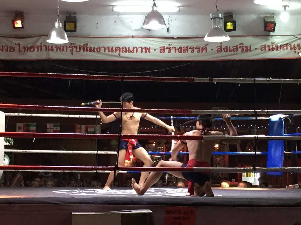 The art of Muay Thai is celebrated through ceremonial dance in the midst of the boxing matches.