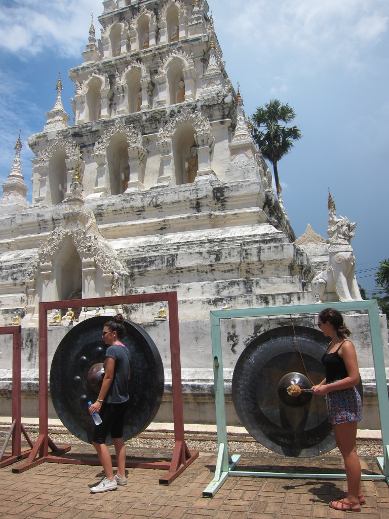 Students rang gongs to honor a local temple during our ride. 